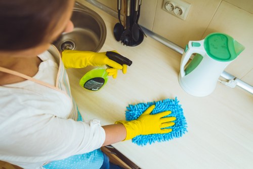Local cleaner treating fabric furniture with specialist equipment