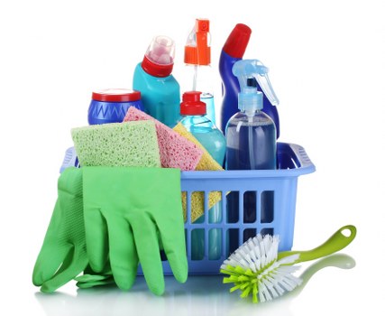 Cleaner dusting and vacuuming in a Hackney living room
